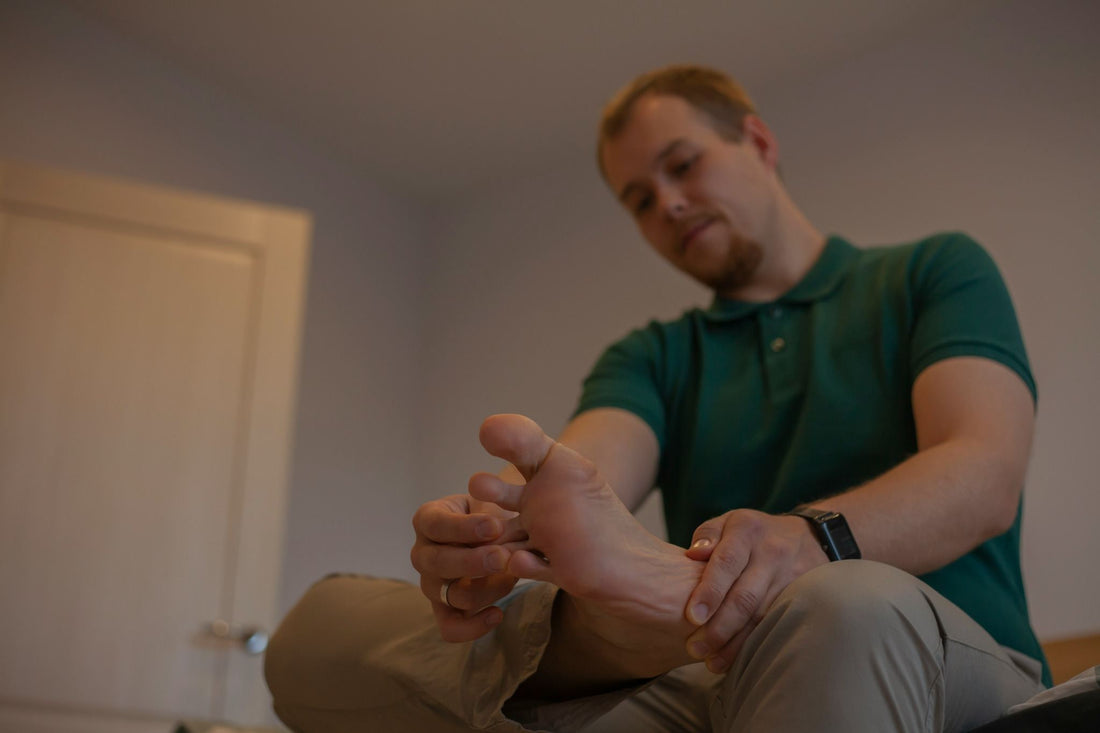 Man with Gout Flare Up Holding Painful Foot