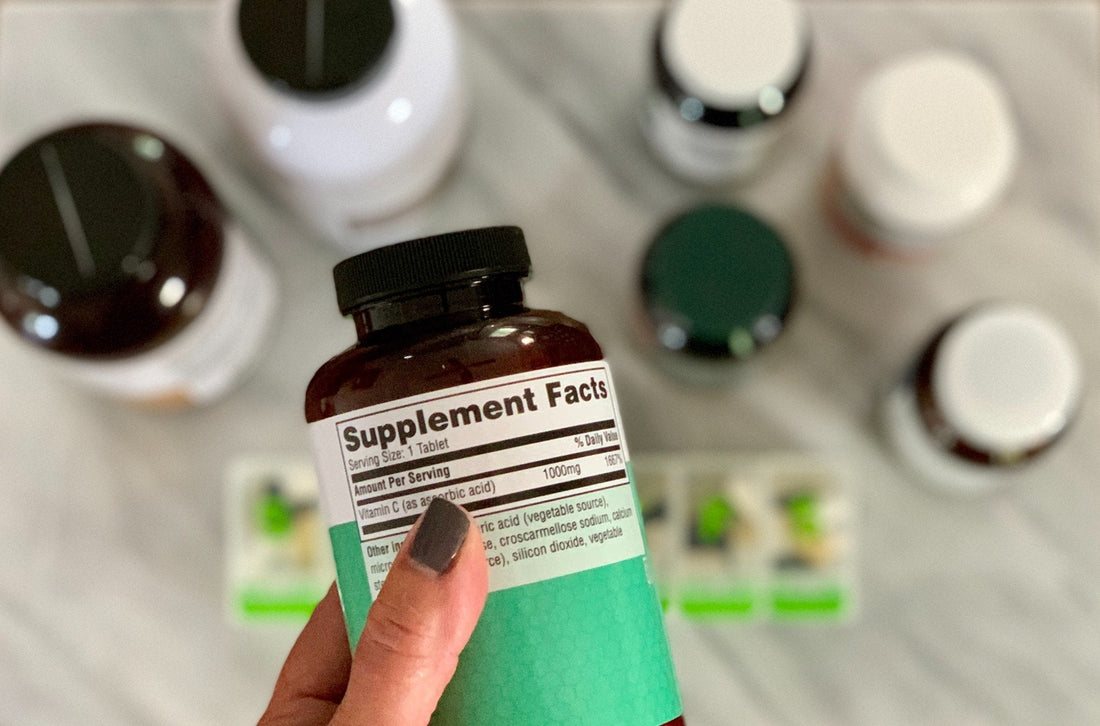 Person Holding Supplement Bottle