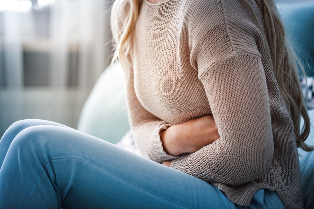 Woman Holding Her Stomach With Abdominal Pain