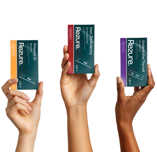 Three hands holding Rezure product boxes against a white background