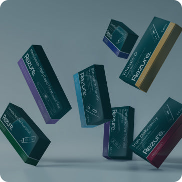 Rezure product boxes in various colors on a gray background